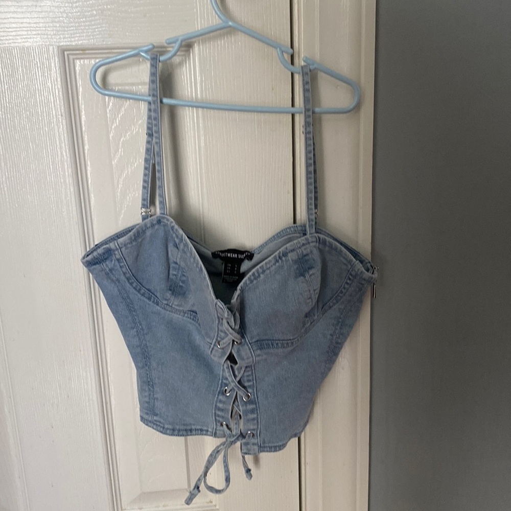 jean tank top zip up on the side, laced up in the front.
